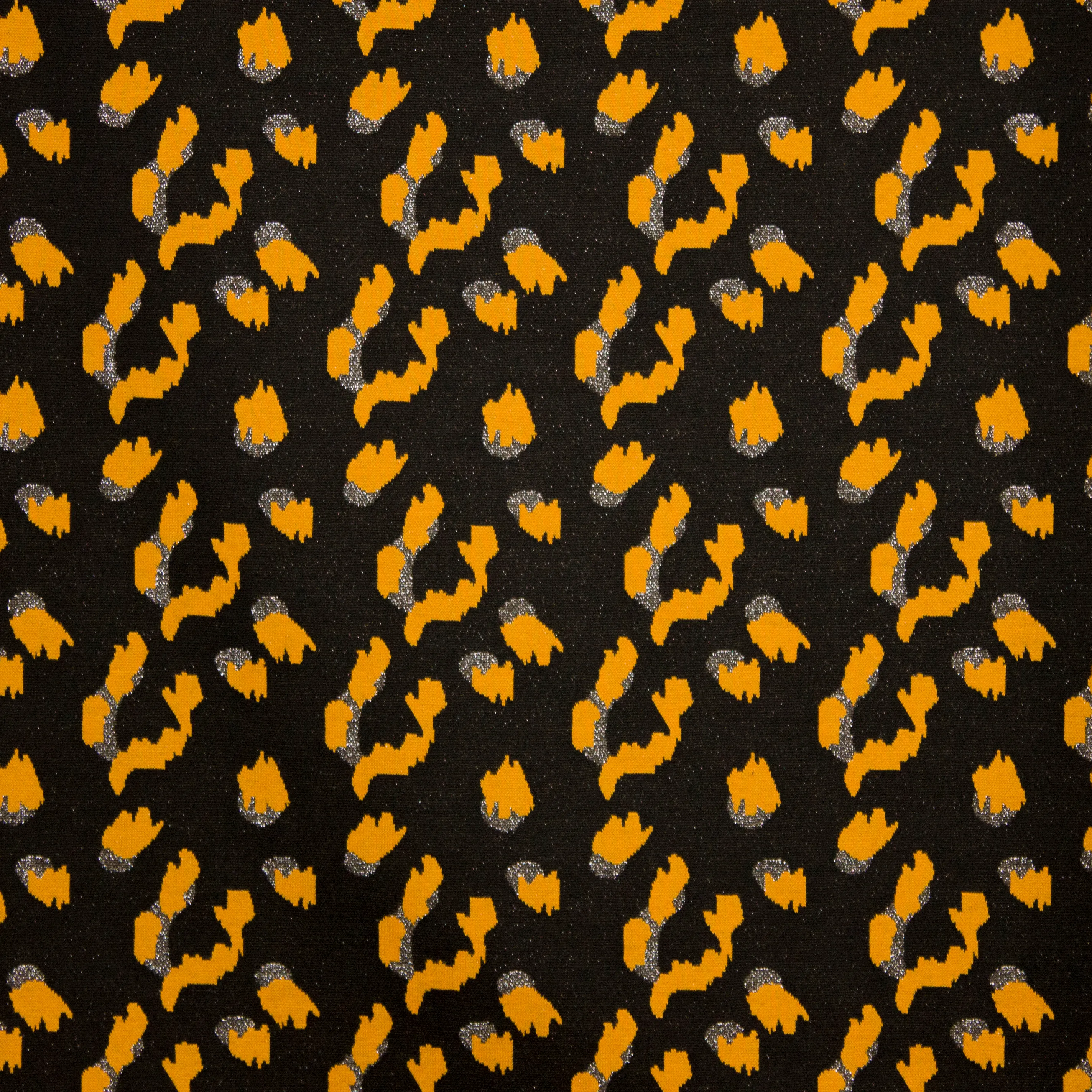 Metallic jersey zwart met oker luipaardprint
