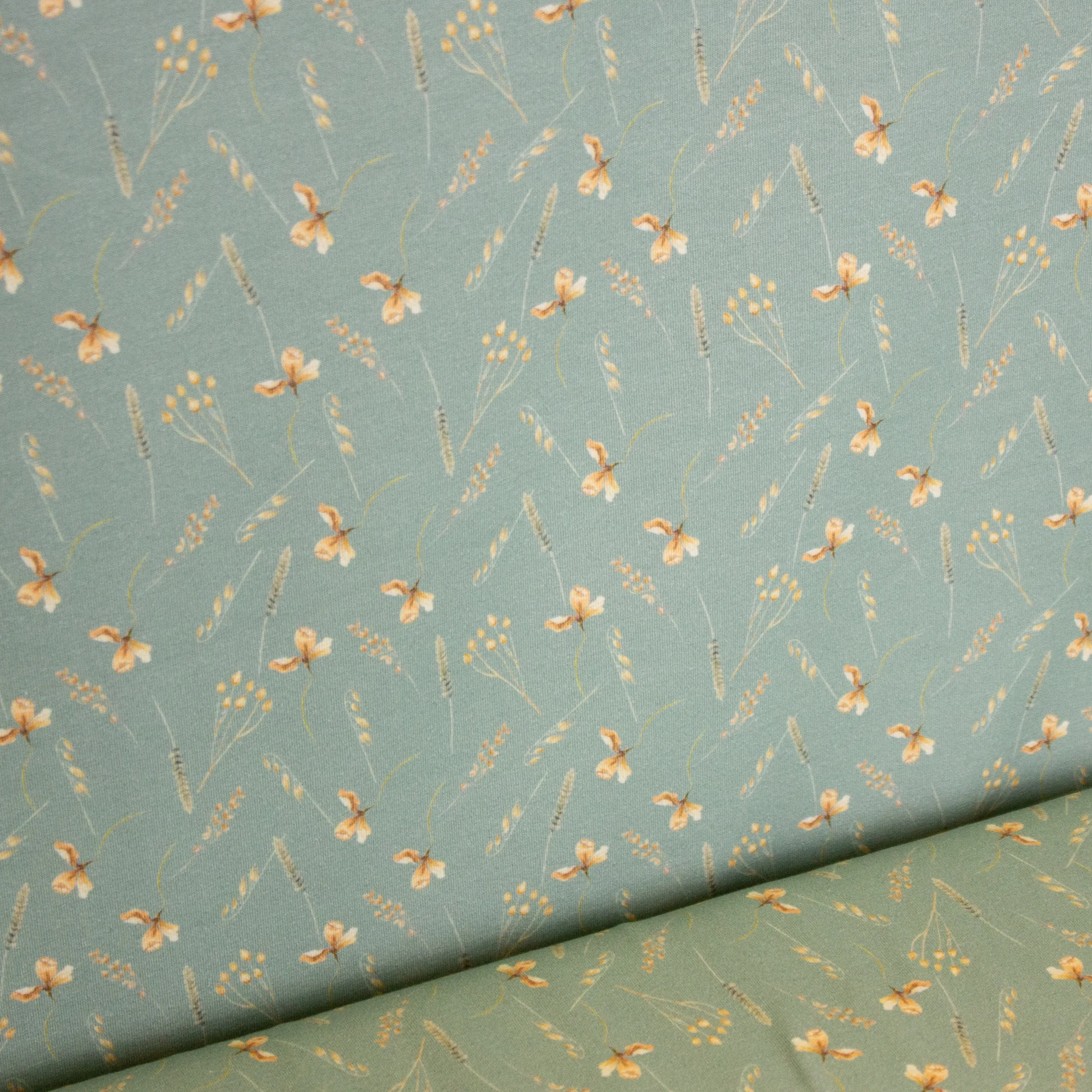 Munt katoen tricot met kleine plantjes