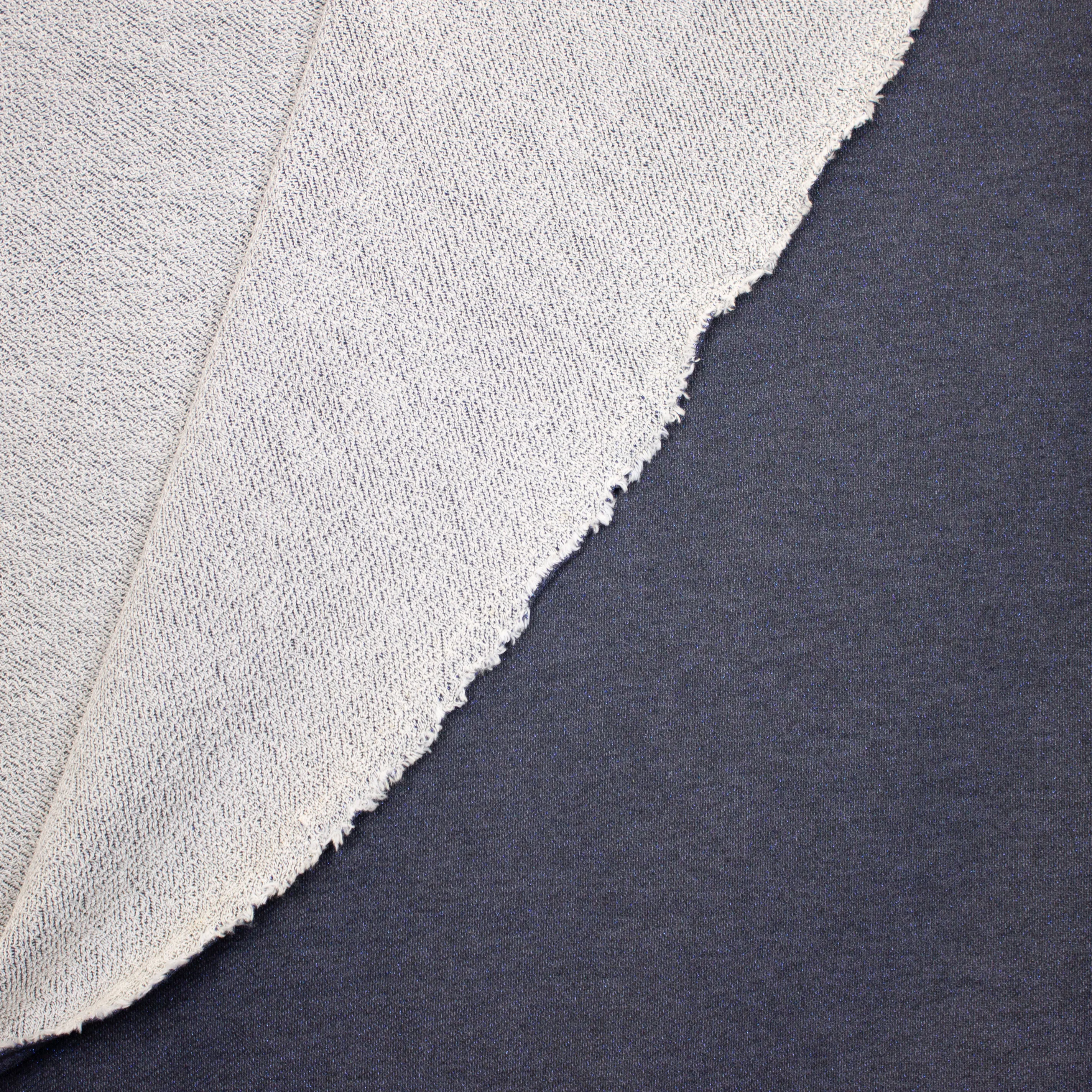 Blauwe sweaterstof in katoen / viscose mengeling met blauwe glitter