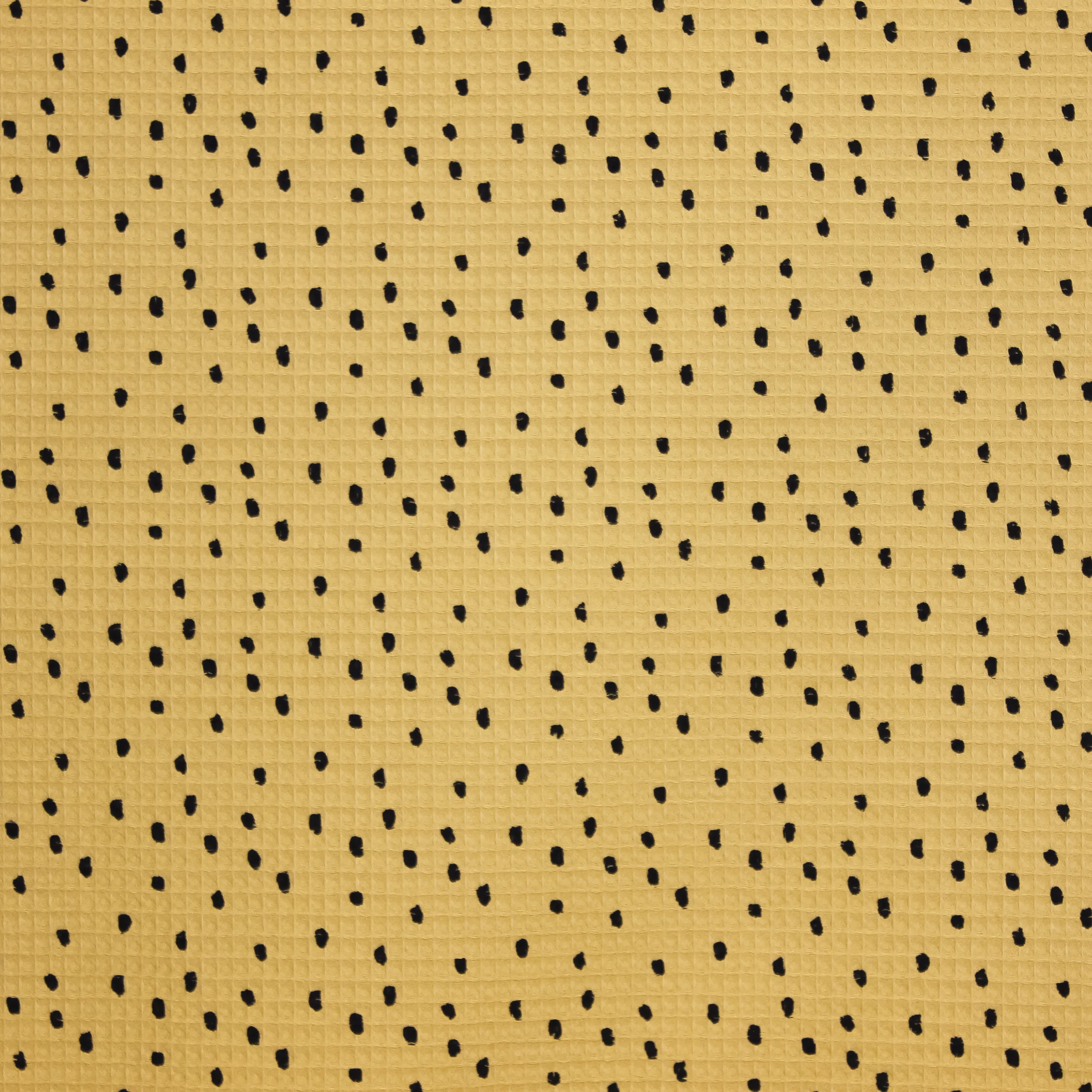 Gele katoenen wafelstof met zwarte stippen