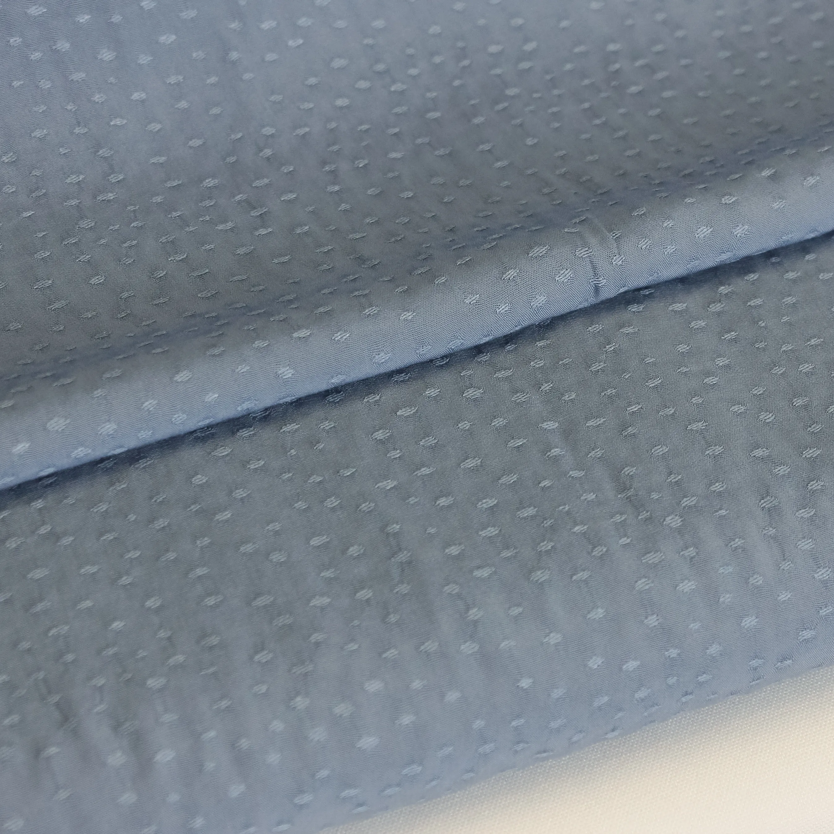 Blauwe soepele viscose stipjes jacquard