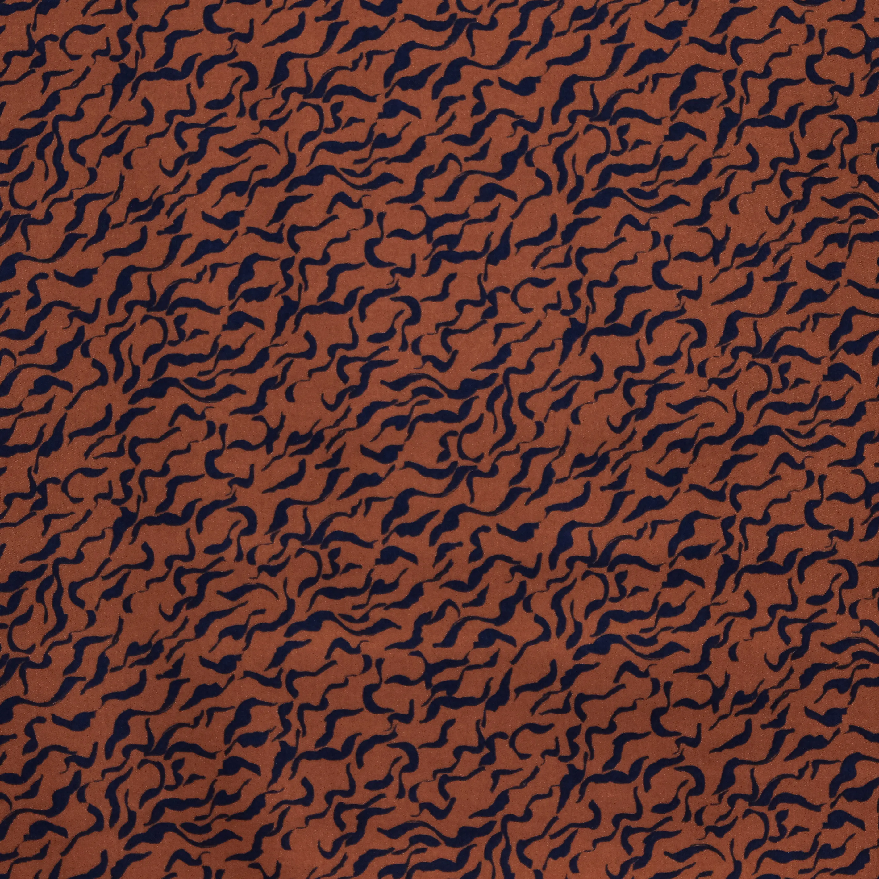 Bruine viscose stretch met zwarte krullen
