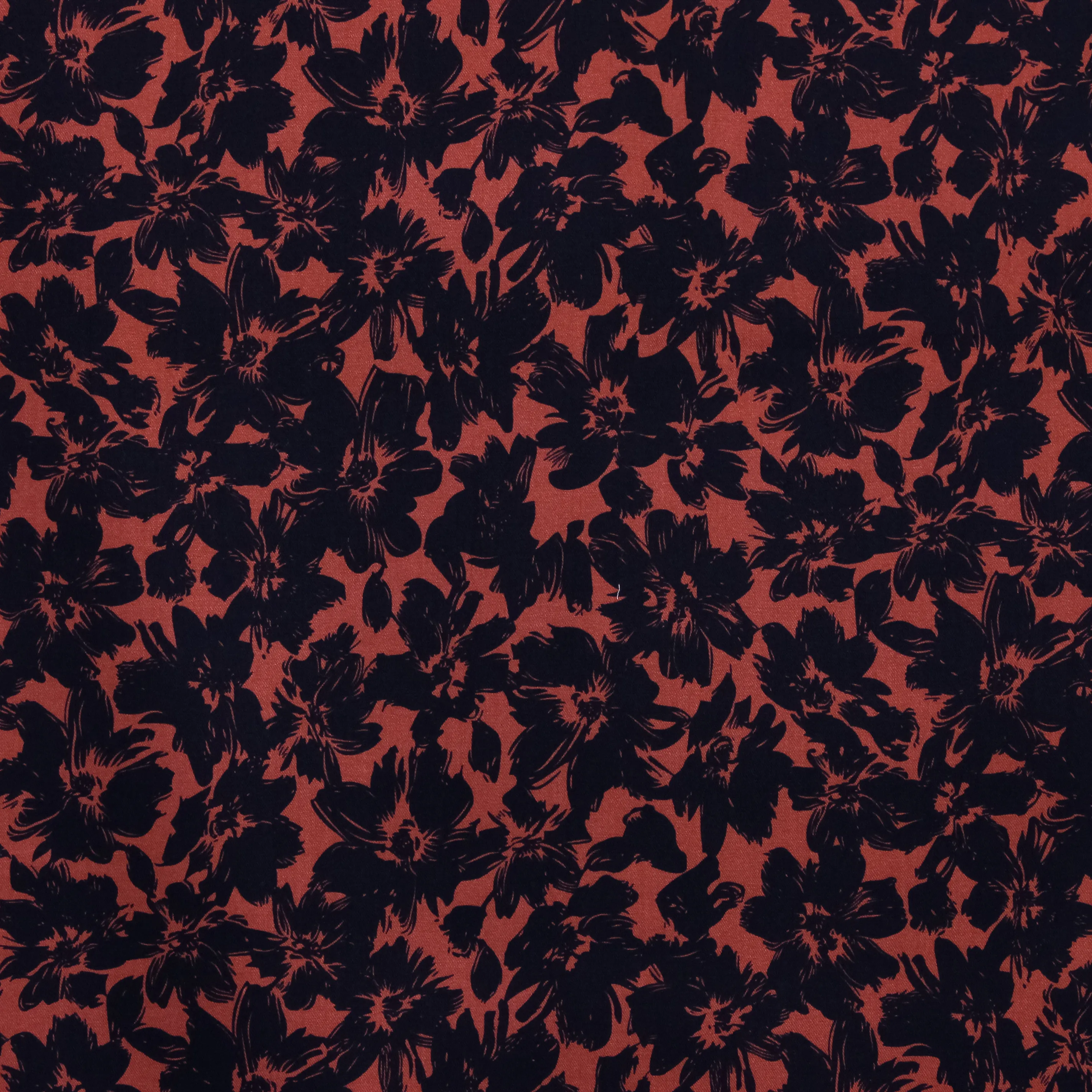 Viscose twill oranjerood met zwarte bloemen