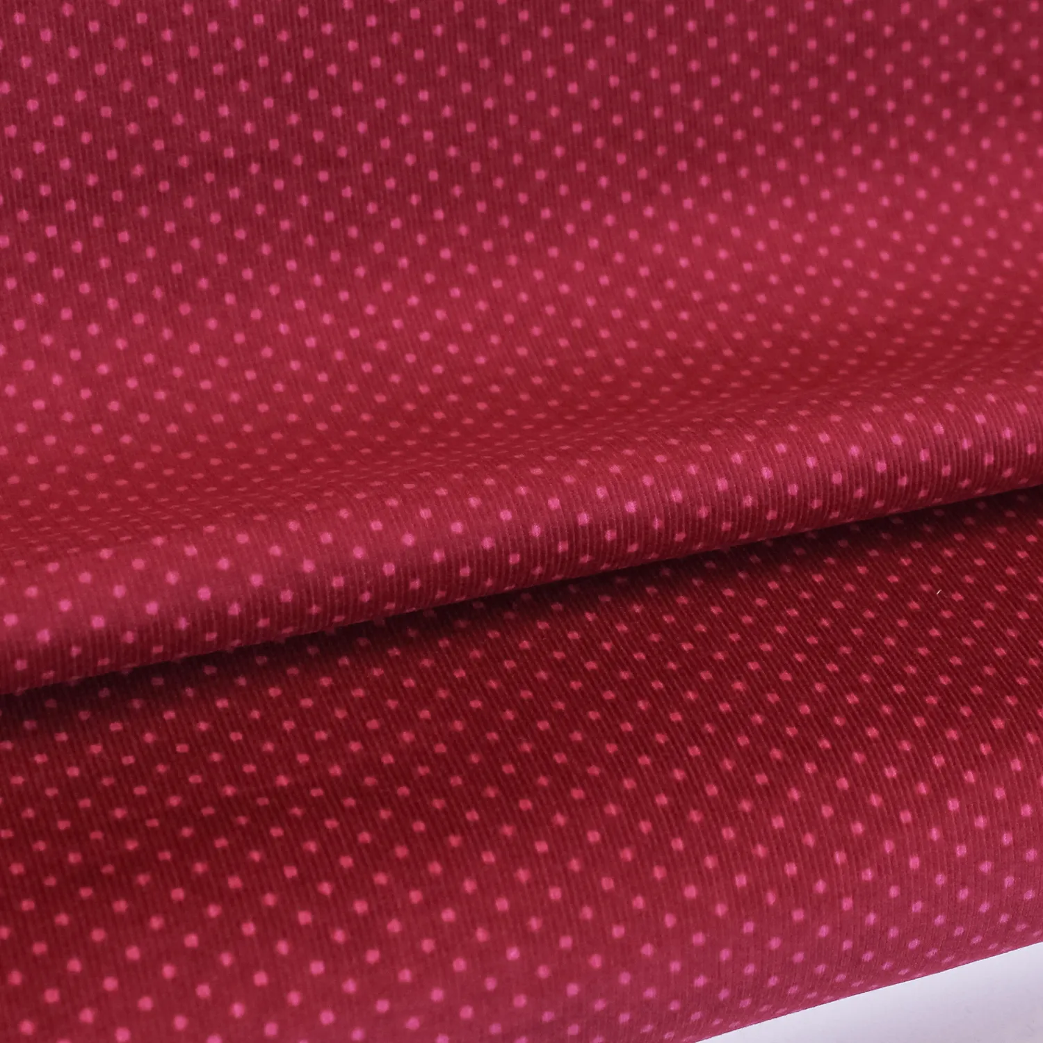 Ribfluweel magenta met stippen