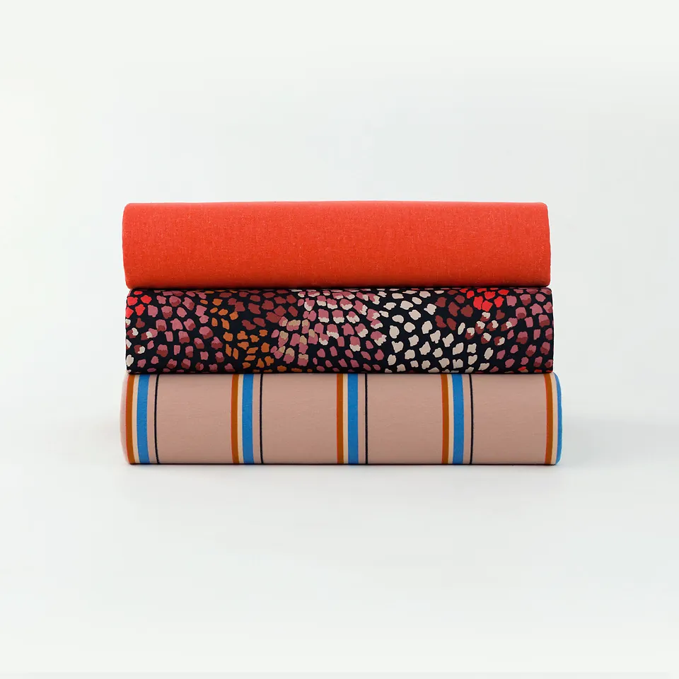 French Terry pastel oranje met gekleurde strepen 'lines' - See you at six