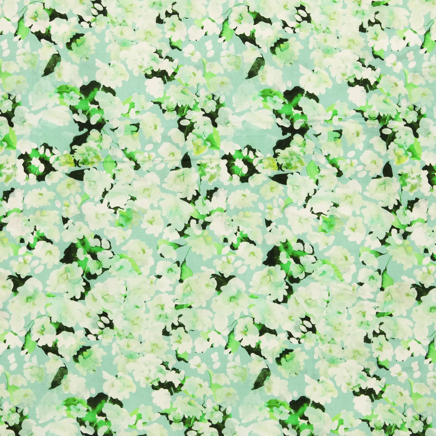 Voile katoen lichtblauw met groene bloemetjes