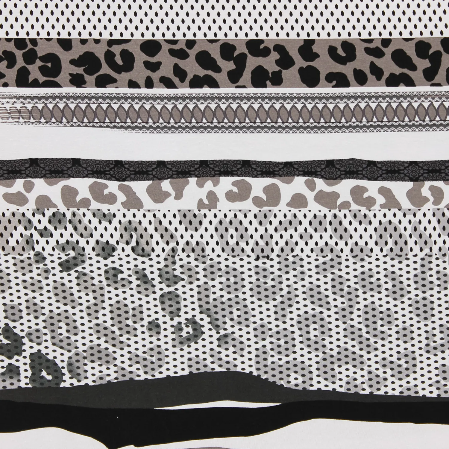 Tricot wit met luipaard/bolletjes patroon