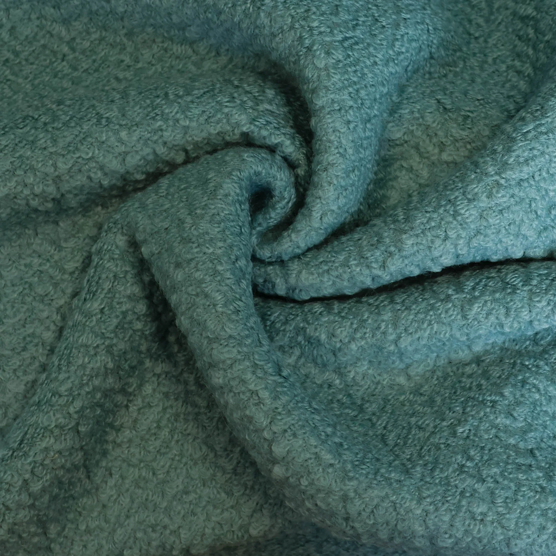 Bouclé turquoise met visgraatpatroon