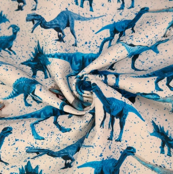 Tricot wit met blauwe dino's - Stenzo