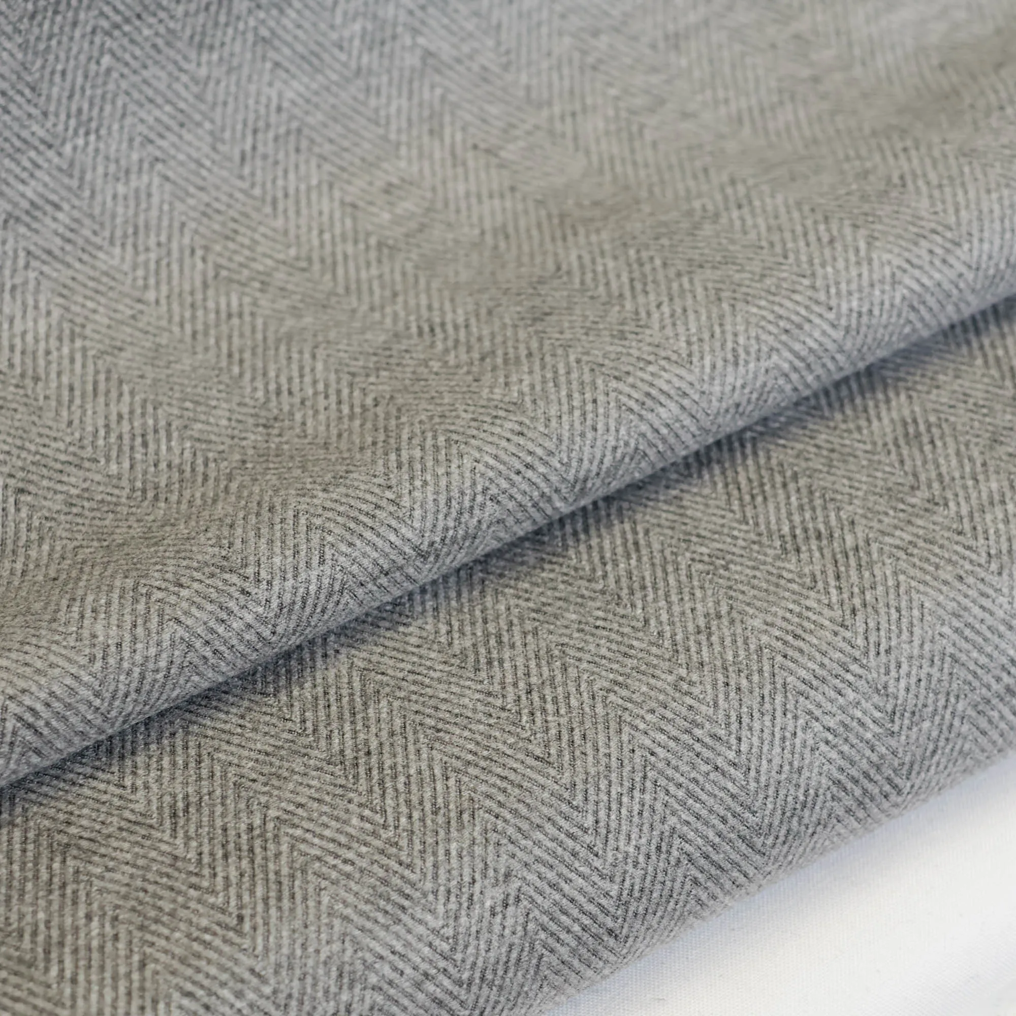 Tweed visgraat grijs