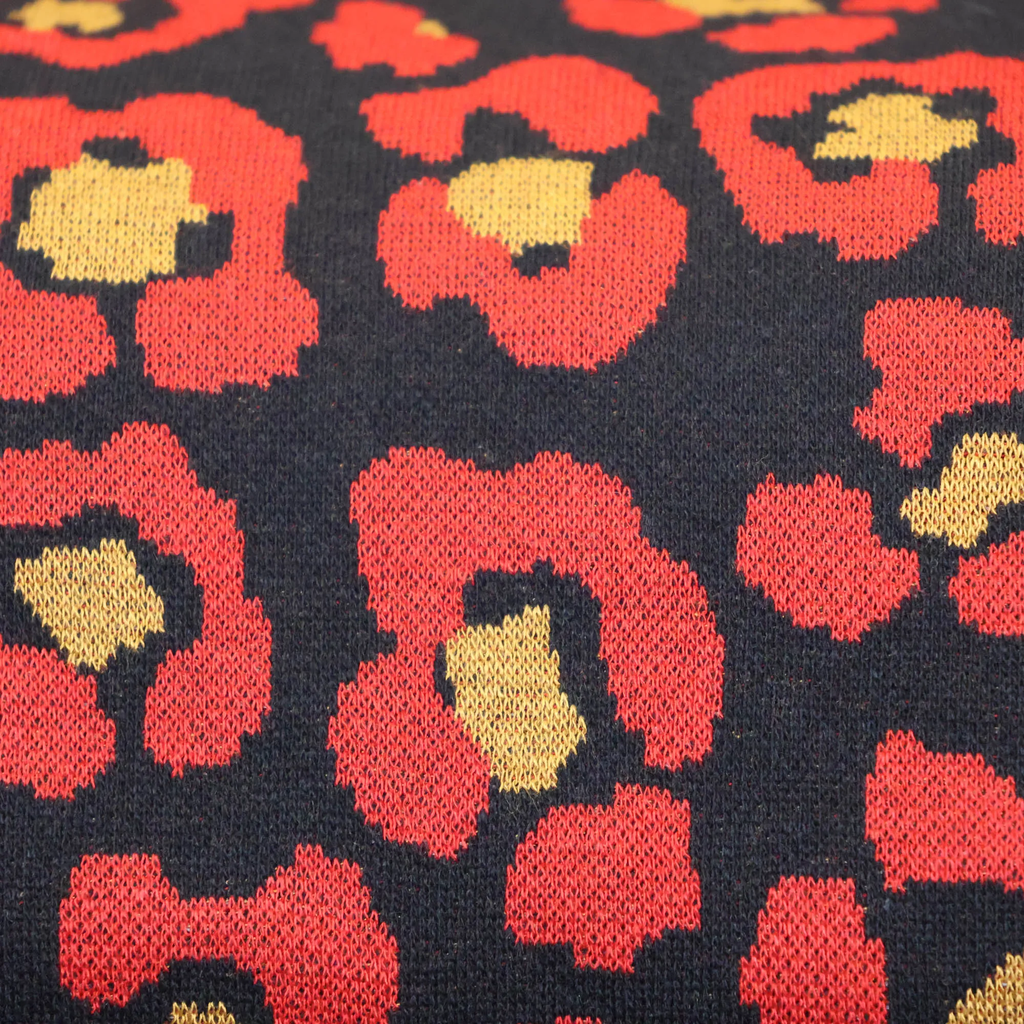 Jacquard tricot met rode pantervlekken
