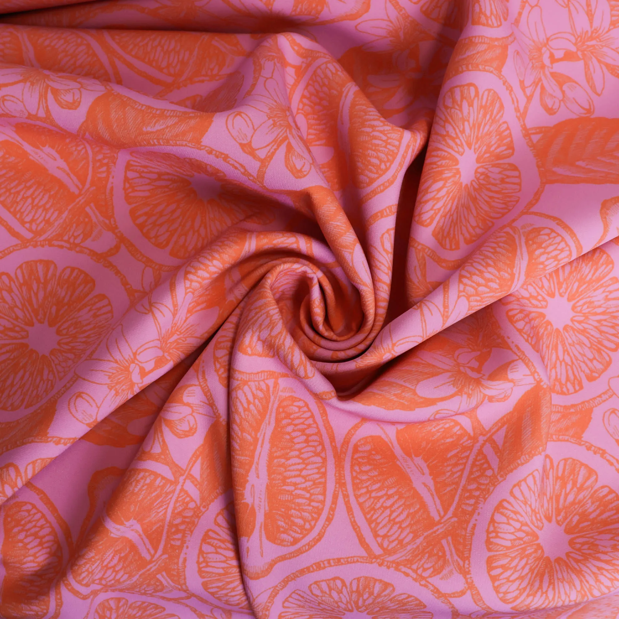 Polyester stretch roze met appelsienen - Knipmode