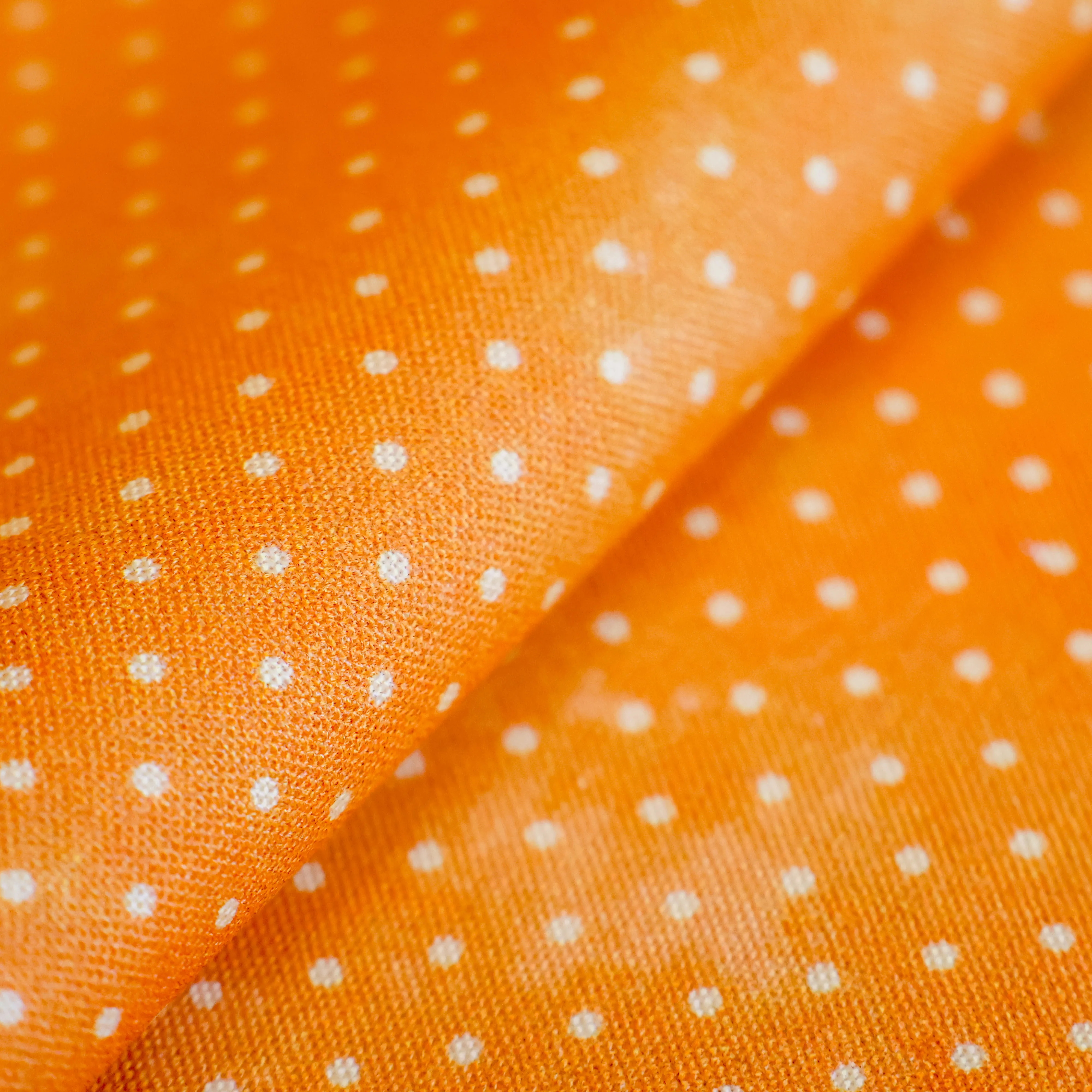 Baumwolle orange mit weißen Punkten