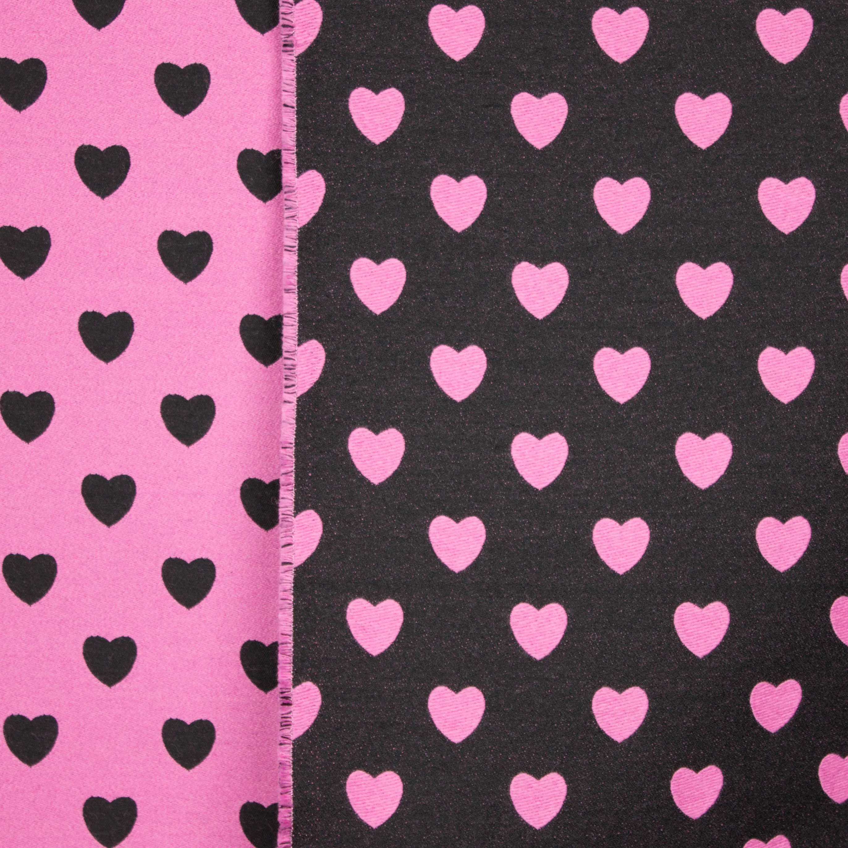 Double face jaquard met hartjes motief in zwart en roze