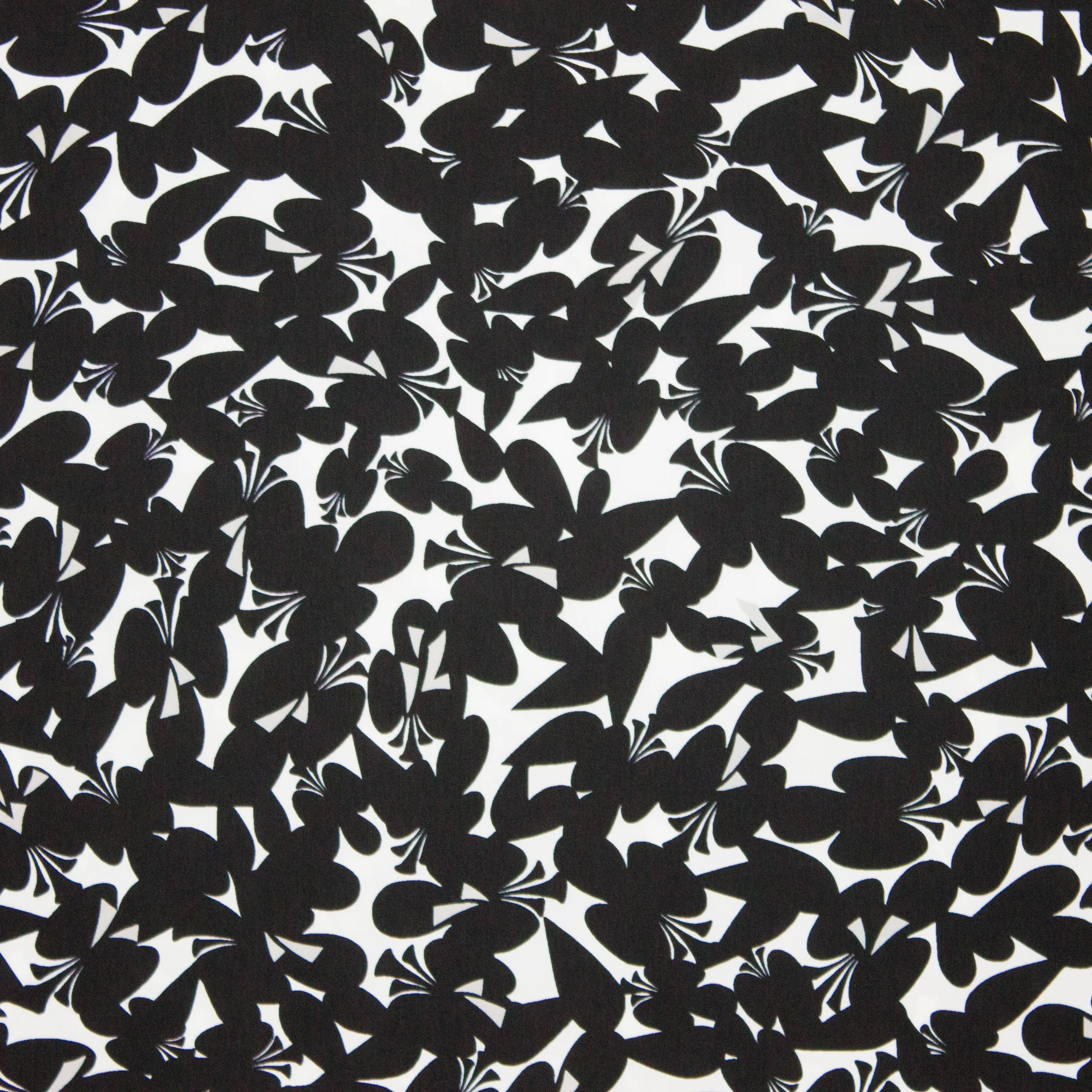 Witte polyester met zwarte klavers