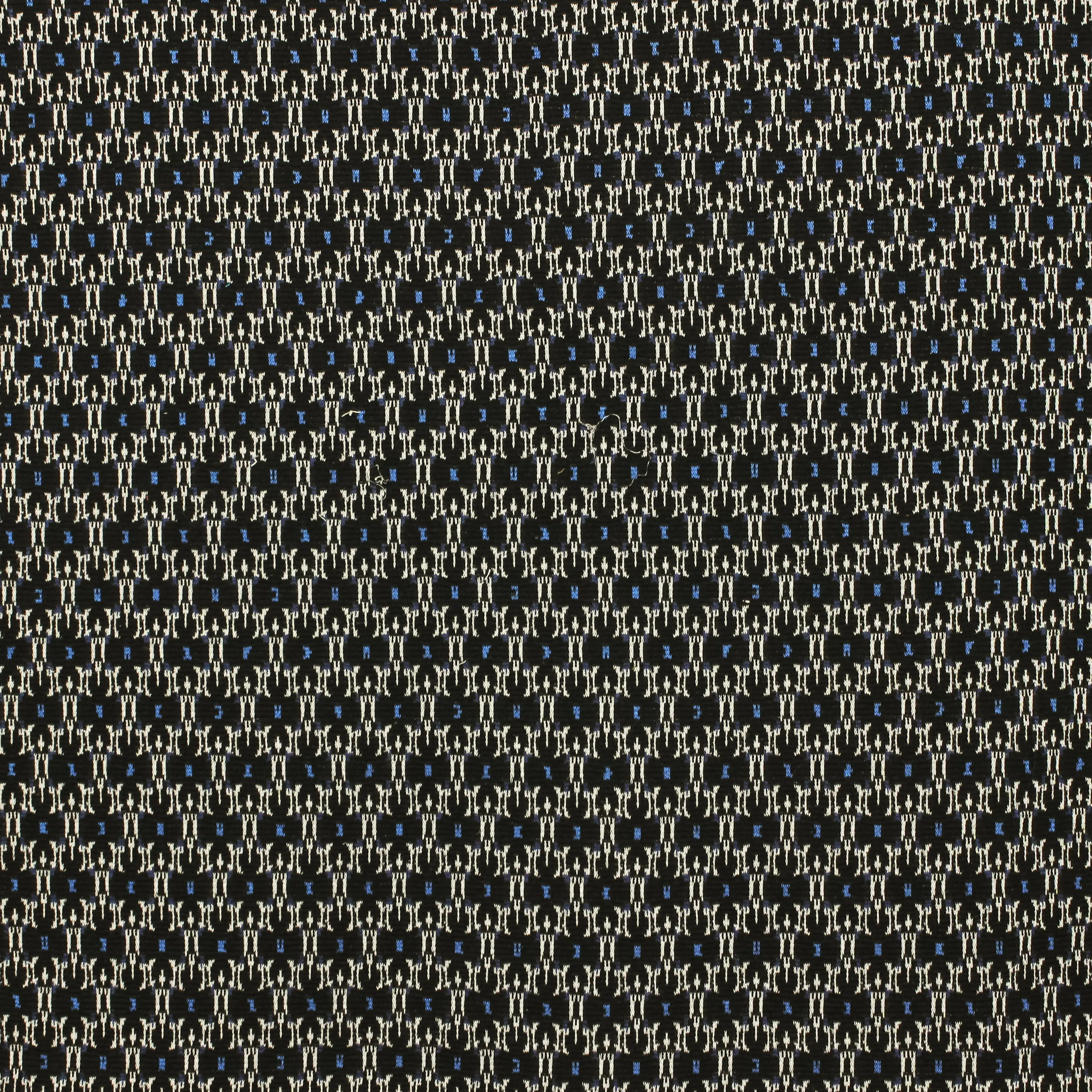 Zwarte gebreide stof met abstract motiefje in blauw en wit