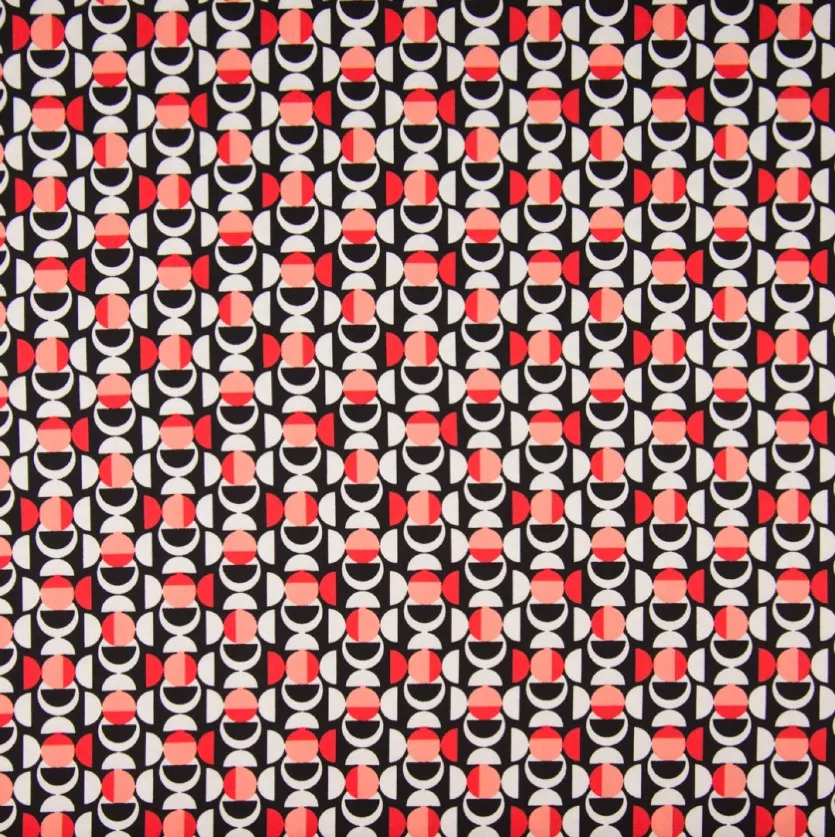 Katoen nylon stretch met cirkelpatronen in rood, wit en zwart