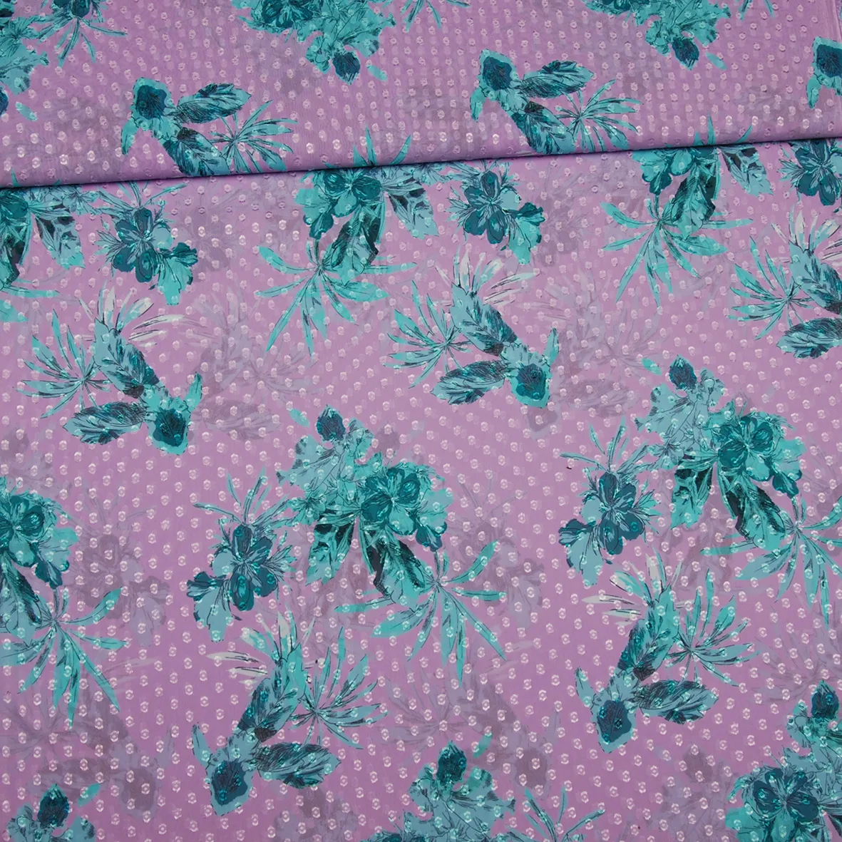 Lila polyester voile met turquoise bloemen - Knipmode