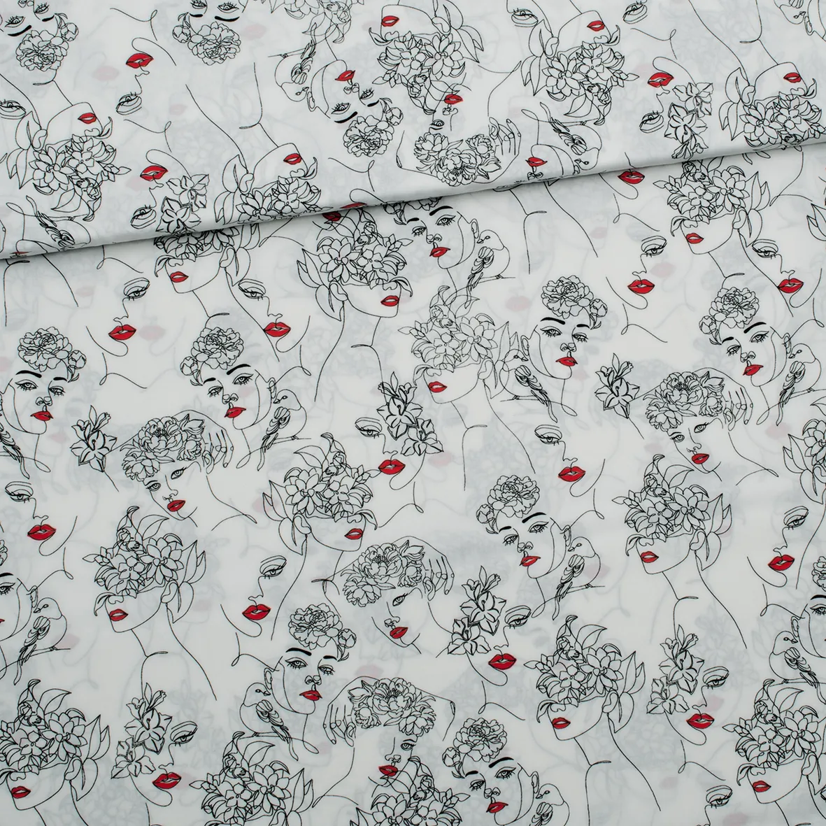 Witte viscose met sierlijke gezichten in zwart en rood
